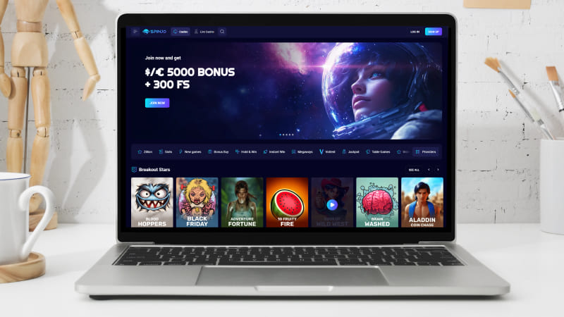 Spinjo Casino hovedside på den bærbare computerskærm